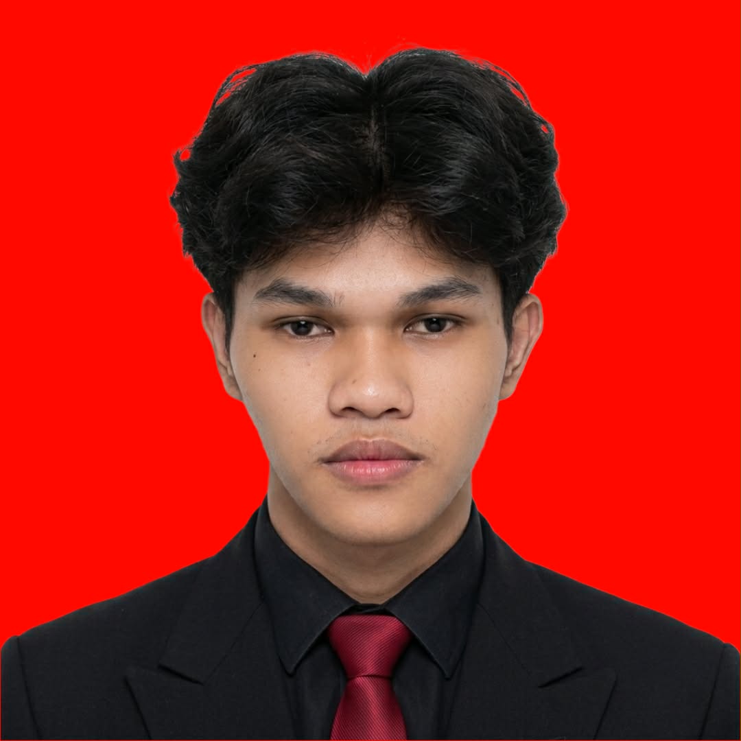 JAYY Guevarra wearing a black suit and red tie